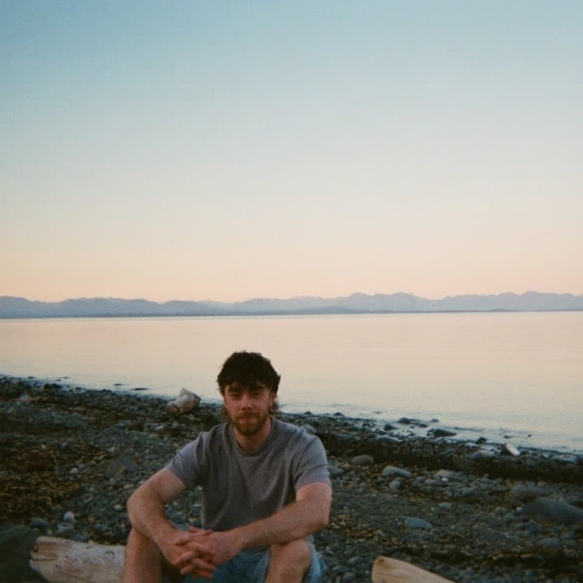 Connor McCarra on the shore at dusk